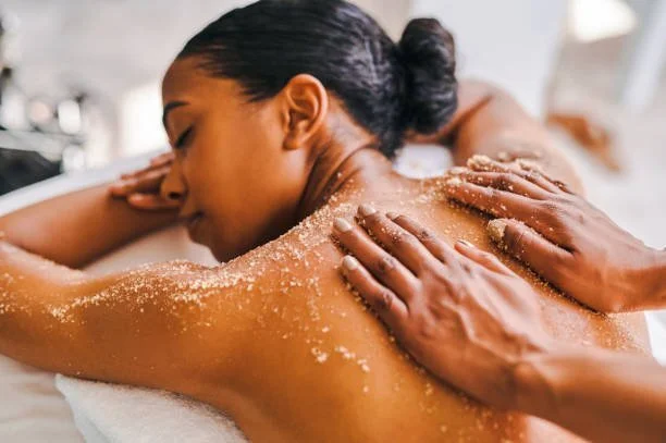 Body scrub being worked over the back